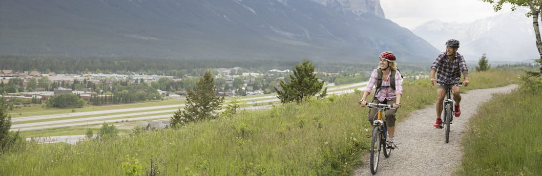 Couple biking outdoors.